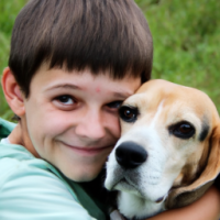 A boy hugging a dog